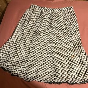 A black and white detailed skirt knee length